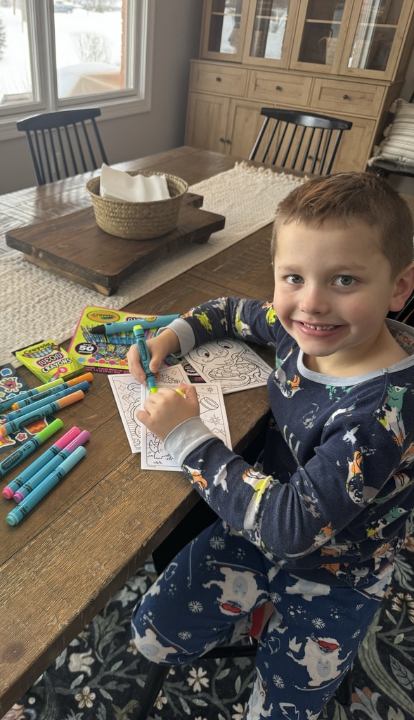 A student is coloring during the Online Learning Day.