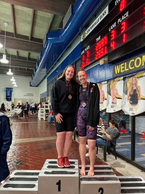 THS girls swimmers on the the podium.
