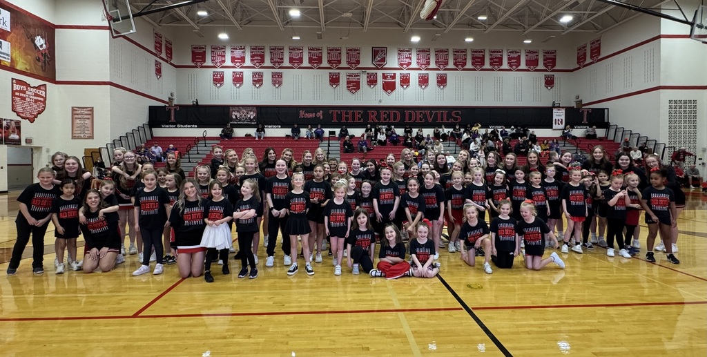 THS cheerleaders with their Lil Devils Cheerleaders on the court for the halftime performance.