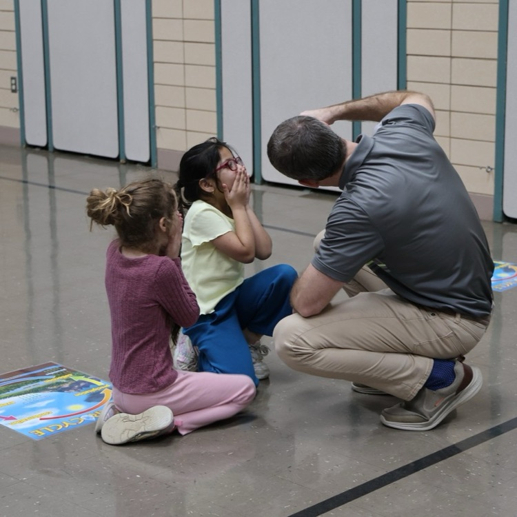 Broadway Elementary students react to creating a tornado presented by COSI.