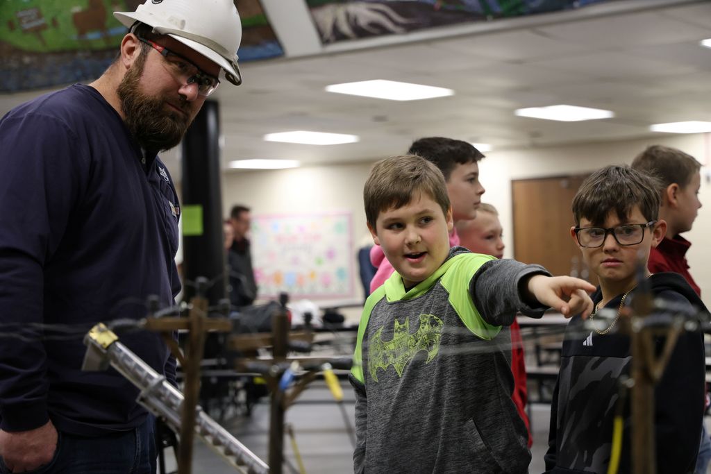 Linemen with Pioneer Electric Cooperative teach L.T. Ball students about electricity and safety. 