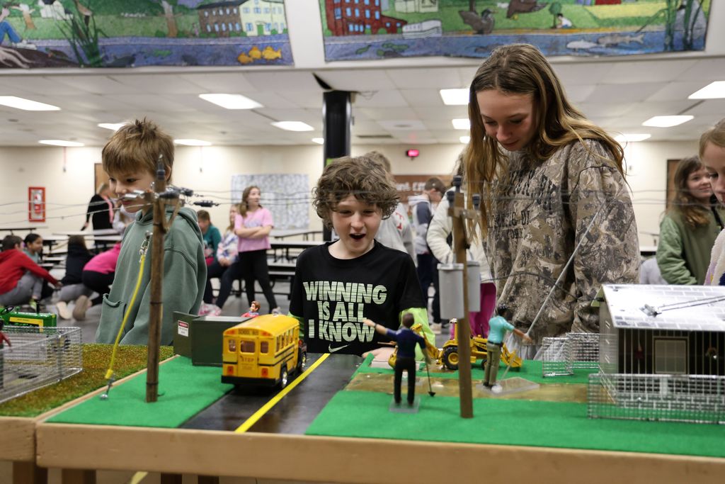L.T. Ball students look at a display that teaches about electricity and safety.