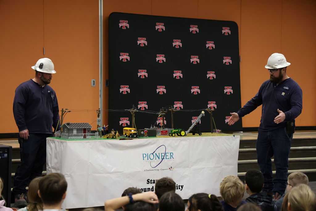 Linemen with Pioneer Electric Cooperative teach L.T. Ball students about electricity and safety. 