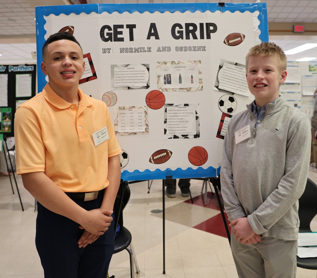 Tippecanoe Middle School student poses with her project at Miami County Science Day.