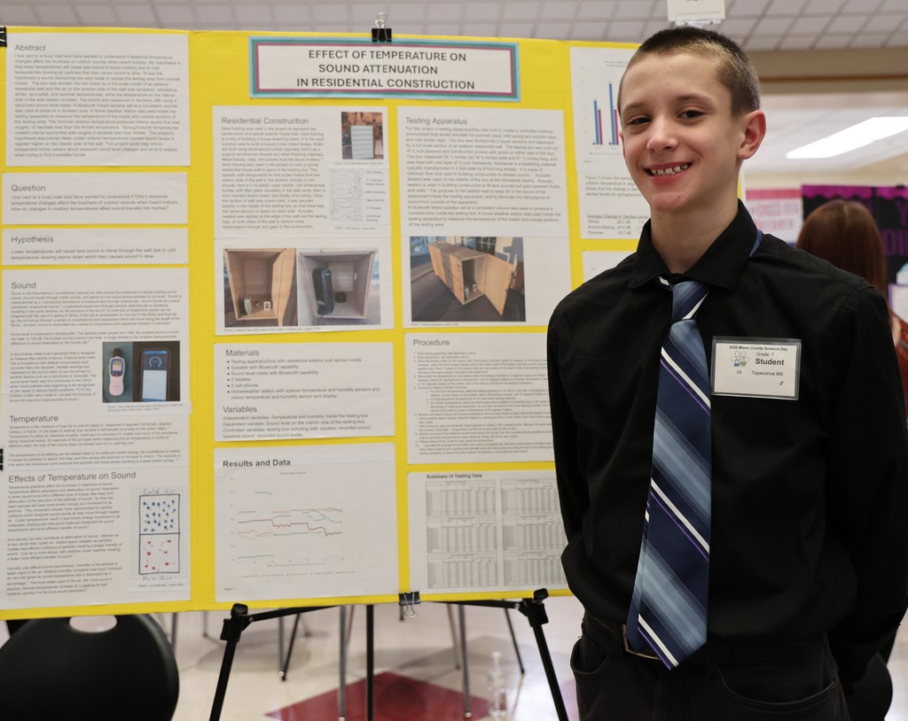 Tippecanoe Middle School student poses with her project at Miami County Science Day.