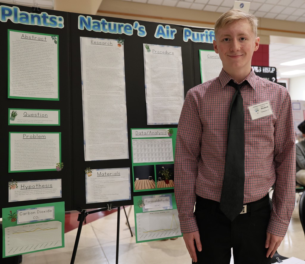 THS student with his project at Miami County Science Day.