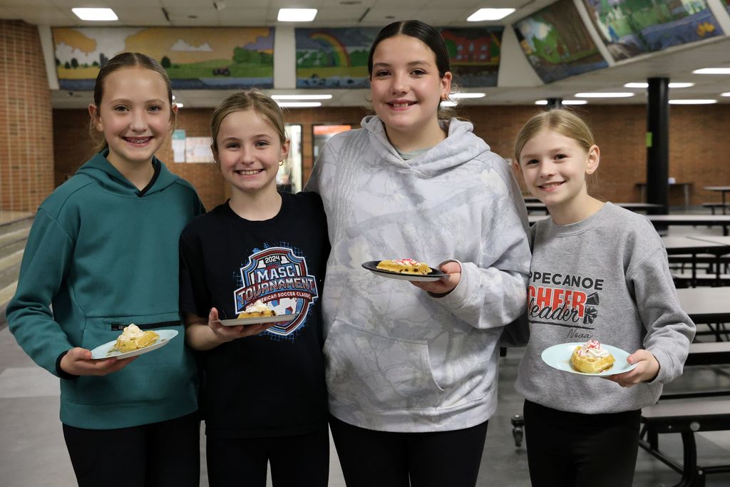 Four L.T. Ball students with their homemade waffles on Waffle Wednesday.  