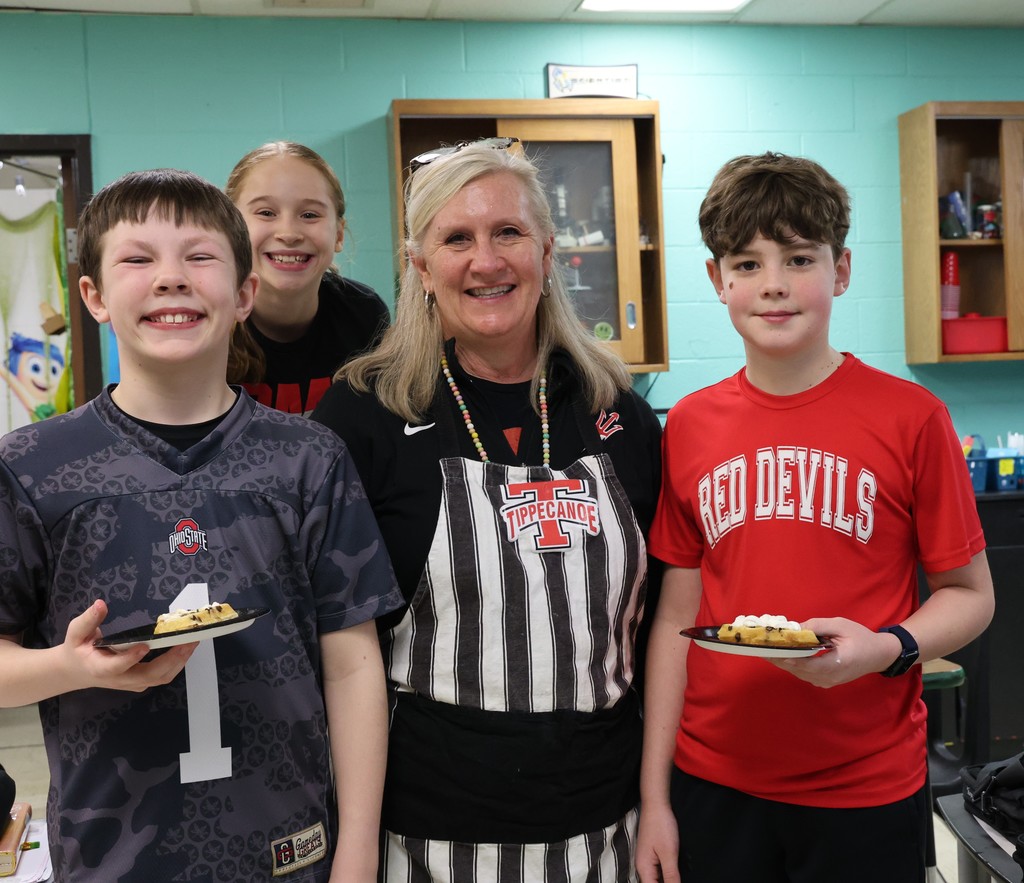 Mrs. Hanes with three students on Waffle Wednesday.