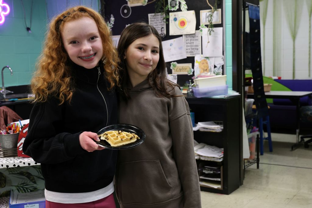 Two students are happy to smile for the camera on Waffle Wednesday.  