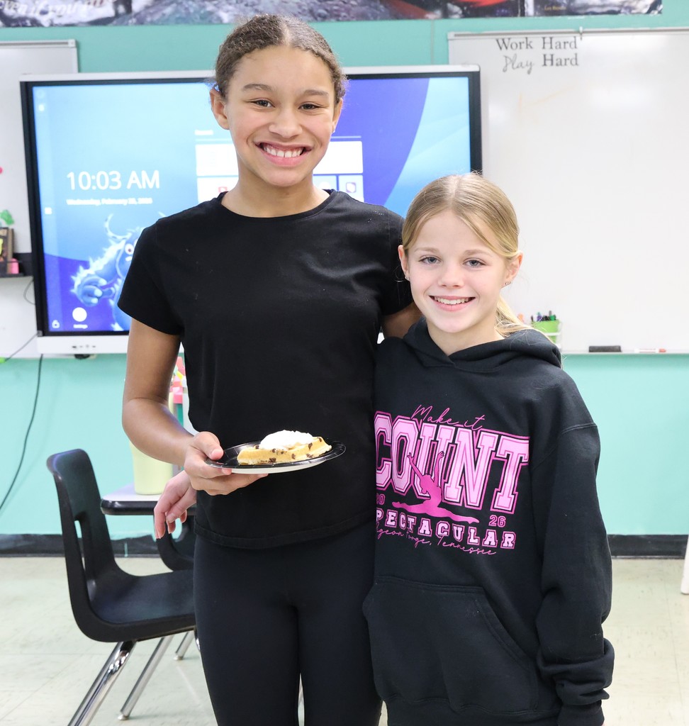 Two students are happy to smile for the camera on Waffle Wednesday.  