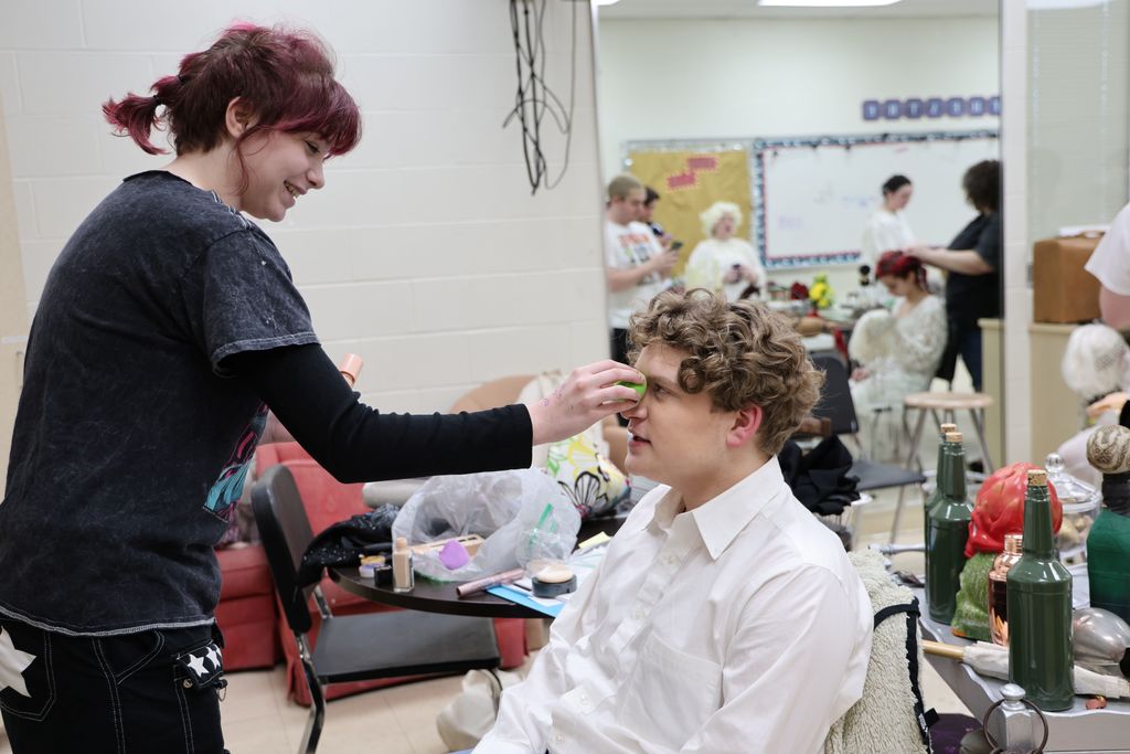 Getting ready for makeup behind the scenes.