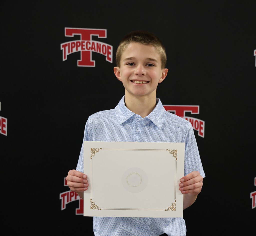 L.T. Ball student at BOE meeting with his certificate.