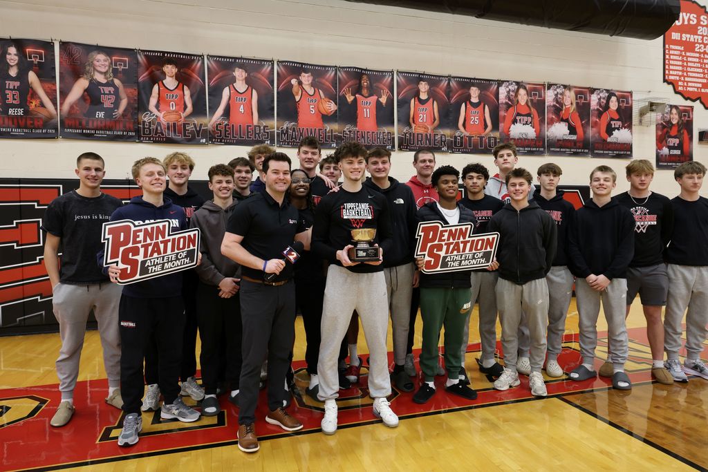 THS senior surrounded by student athletes as he gets awarded as Penn Station Athlete of the Month from WDTN