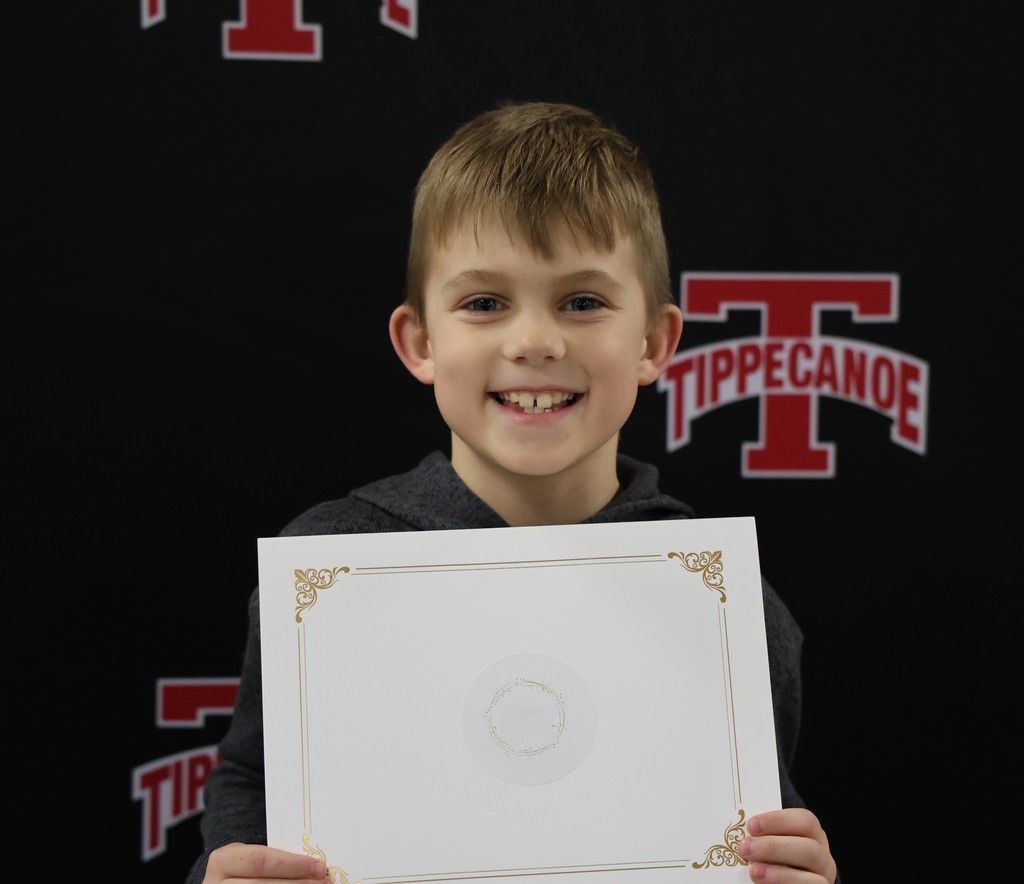 A Broadway students holds his certificate after being recognized at the BOE meeting for his leadership skills. 