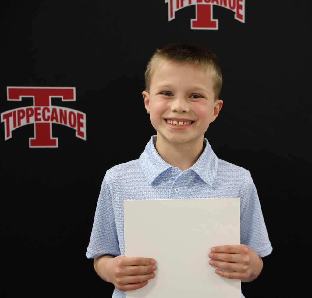 Broadway Elementary student beams with pride after being honored at the monthly Board of Education meeting.