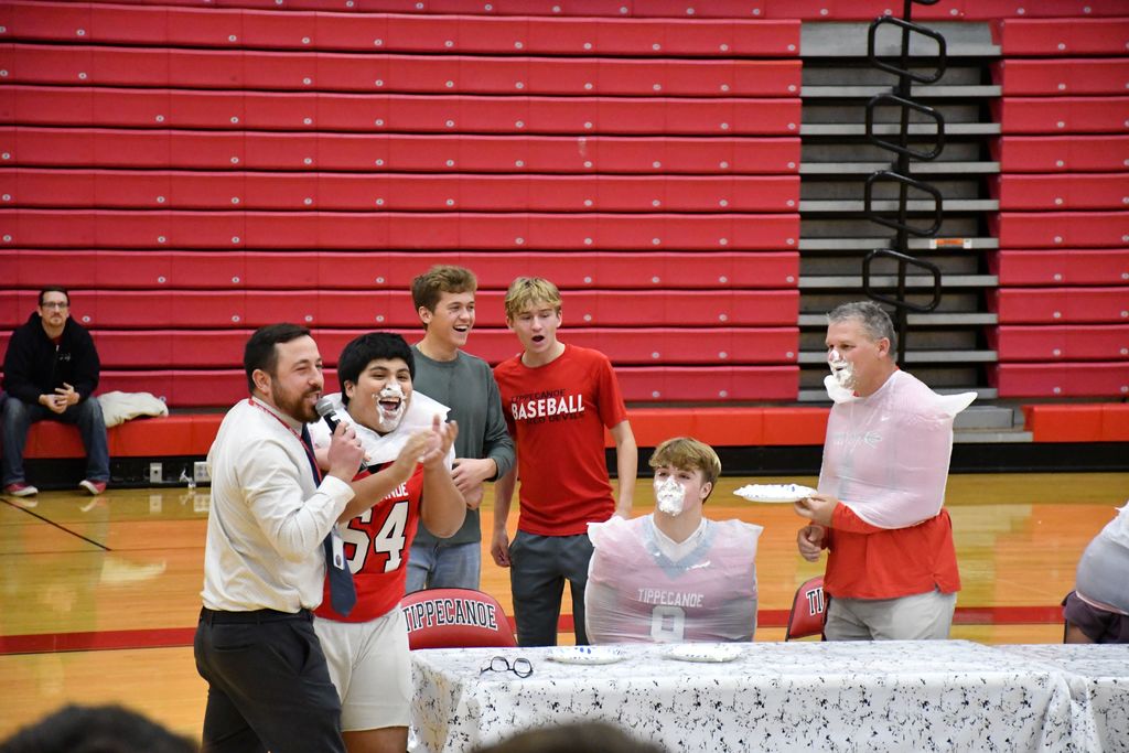 The pie eating contest at a fall pep rally.
