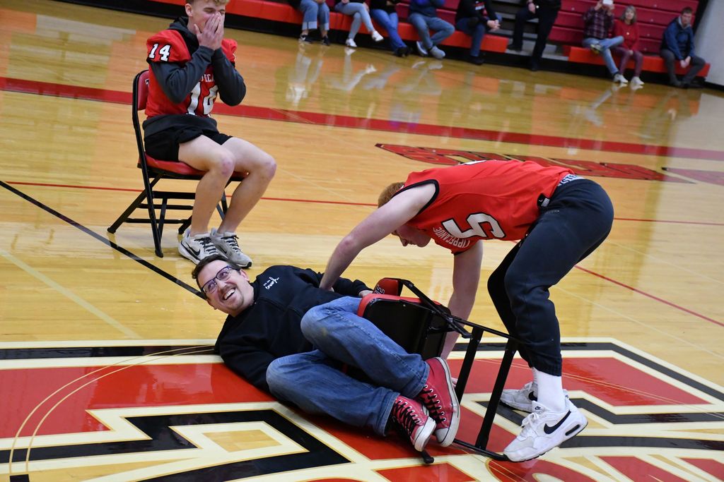 A THS teacher and students battle for the win during a pep rally.