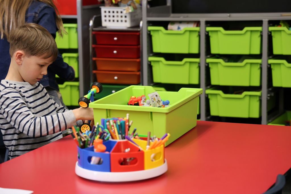 A Broadway students works on making a vehicle.  