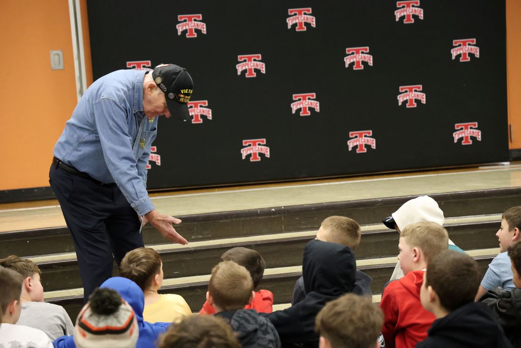 A veteran who received a letter from an L.T. Ball student gets ready to shake his hand.  