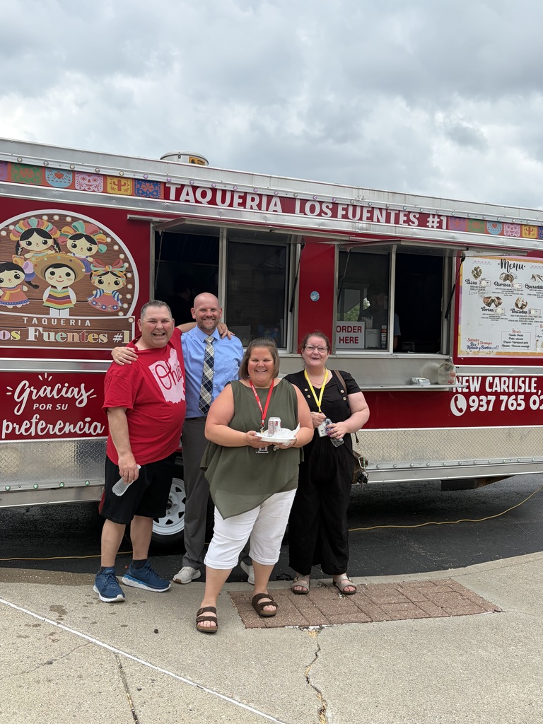 THS staff pose for a photo after getting lunch from a food truck courtesy of PWC.