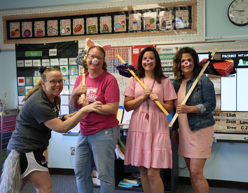 Broadway Elementary kindergarten teachers dressed as the three little pigs and the big pad wolf..  