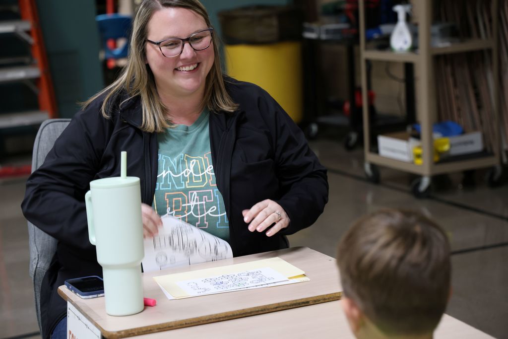 Mrs. Lynch laughs with a future kindergarten student.  