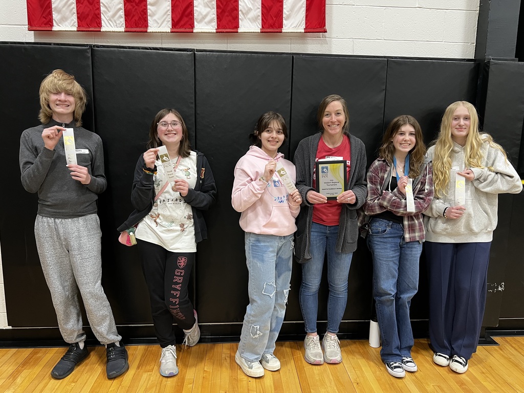 TMS Power of the Pen team with their awards and coach.