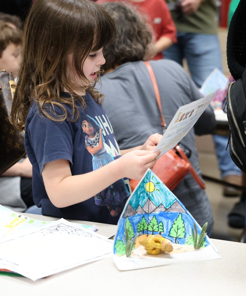 A Broadway Elementary student reads her report to school visitors.  