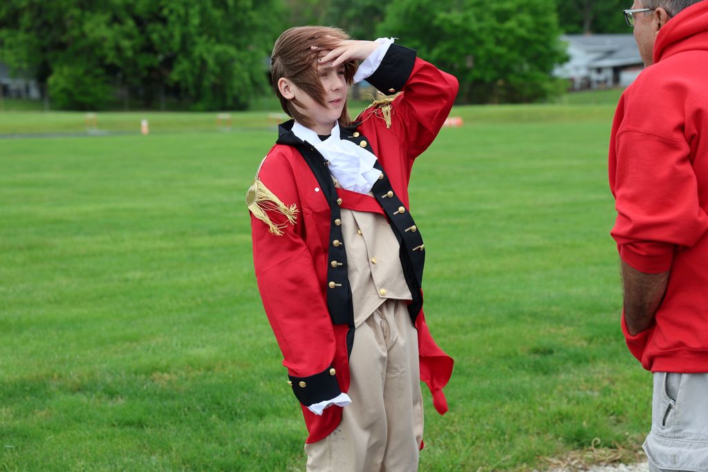 A students gives a presentation at the wax museum.