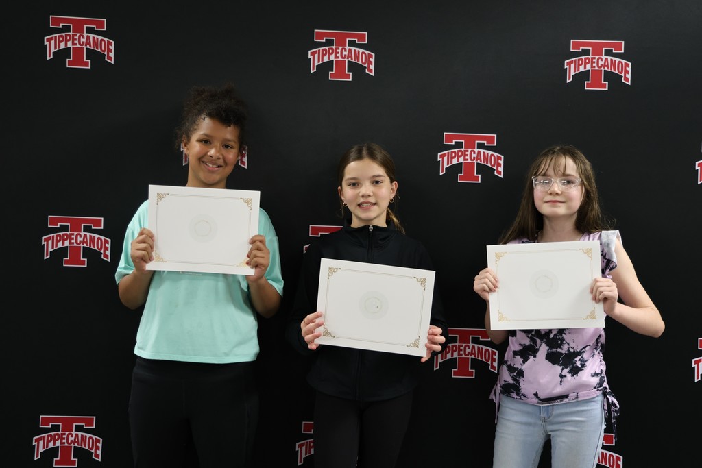 Three L.T. Ball students hold their certificates from the Board of Education. 