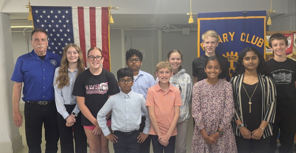 Students presented their award-winning science fair projects to the Tipp City Rotary.  They are pictured with Dr. Martin English.