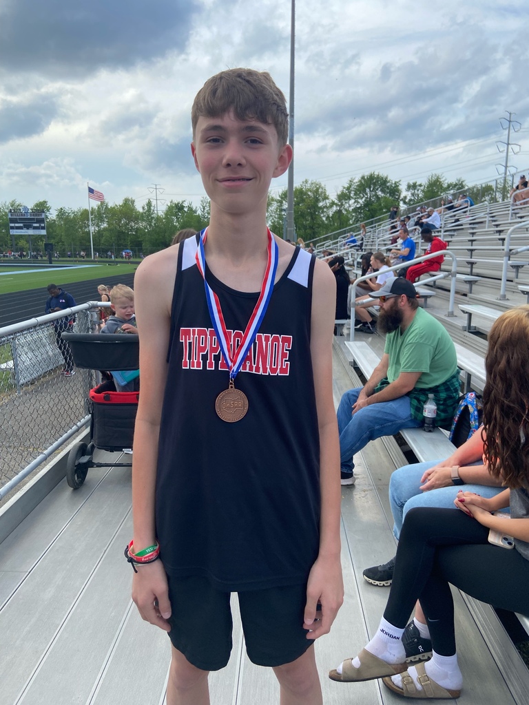 TMS runner Seth Royer with his medal after his fifth place finish.