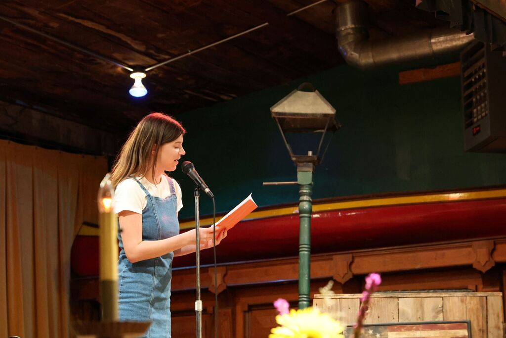 THS hosted the Inferno Book Release.  A student reads her work.