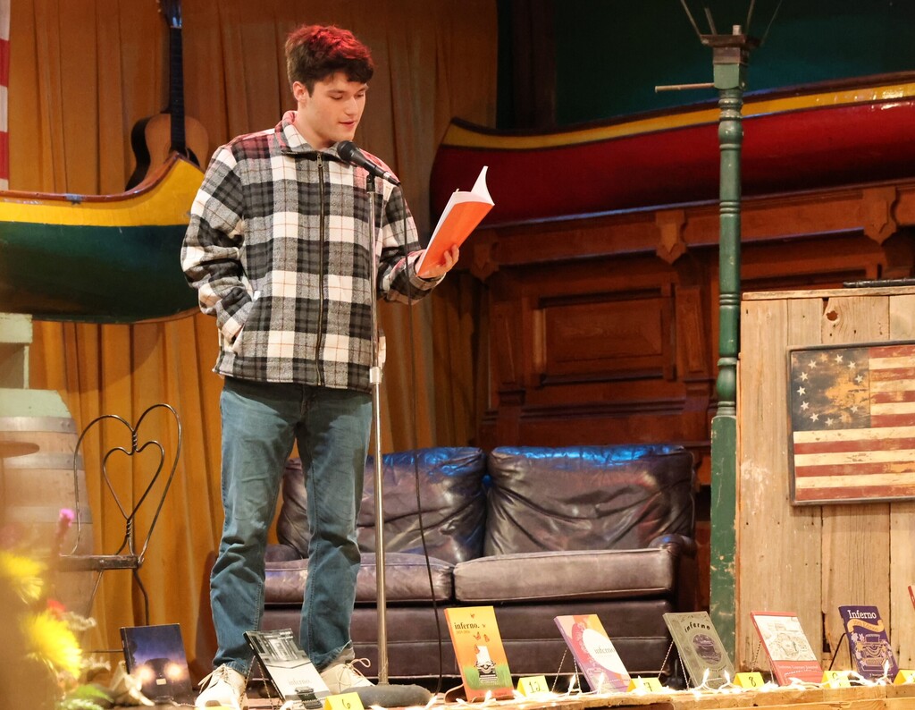 THS hosted the Inferno Book Release.  A student reads his work.
