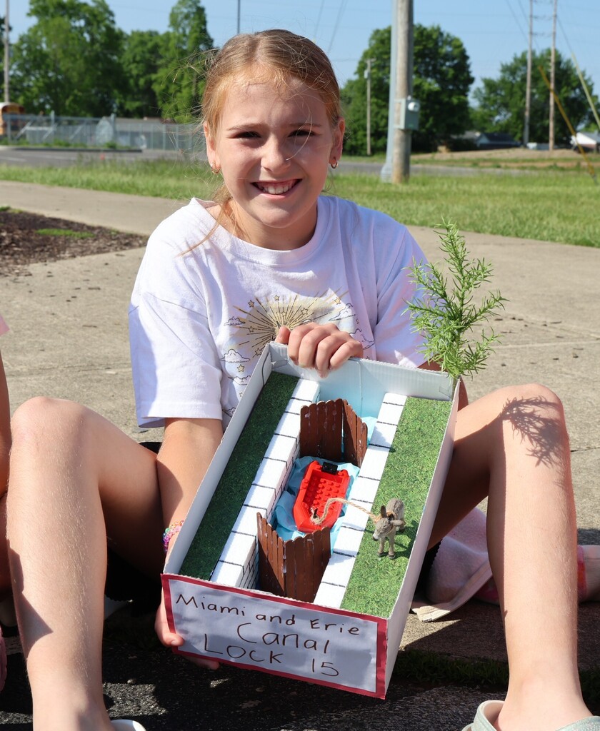 An LT Ball student shows off the Tipp City float of the Canal Lock 15 created for class.  