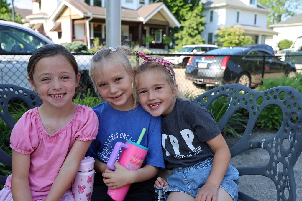 Three Broadway Elementary students smile for the camera on their water break. 