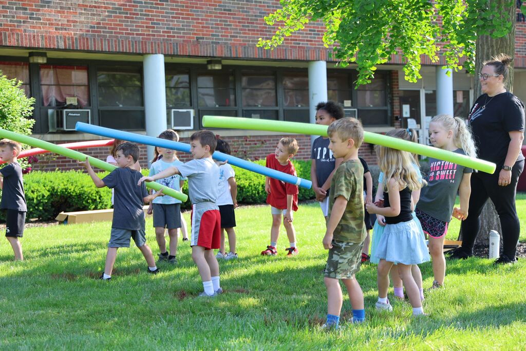 Broadway students get ready to test their throwing arms with a pool noodle toss.  