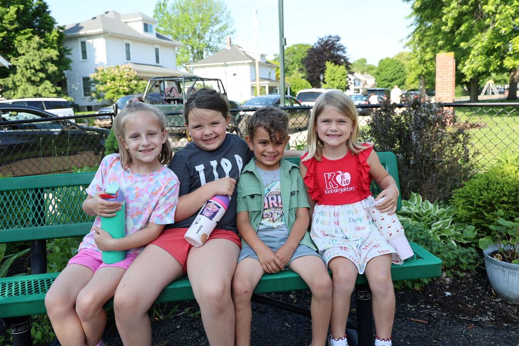 Four Broadway Elementary students take a water break during field day.