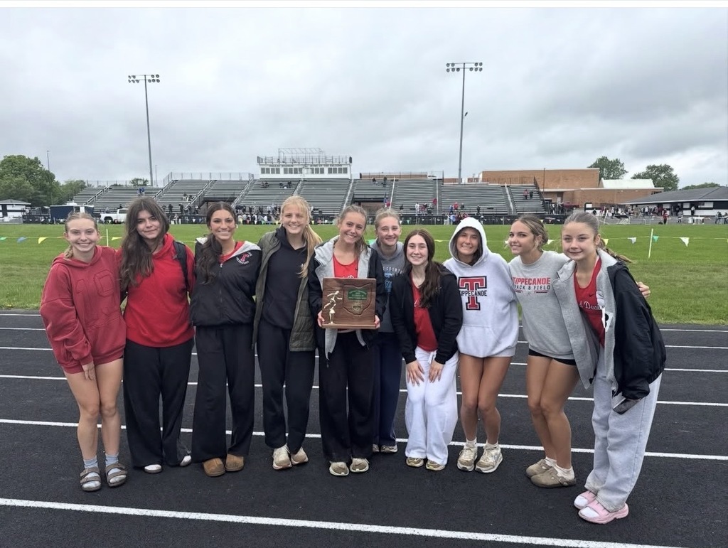 THS girls track and field team pose with the District Championship trophy.