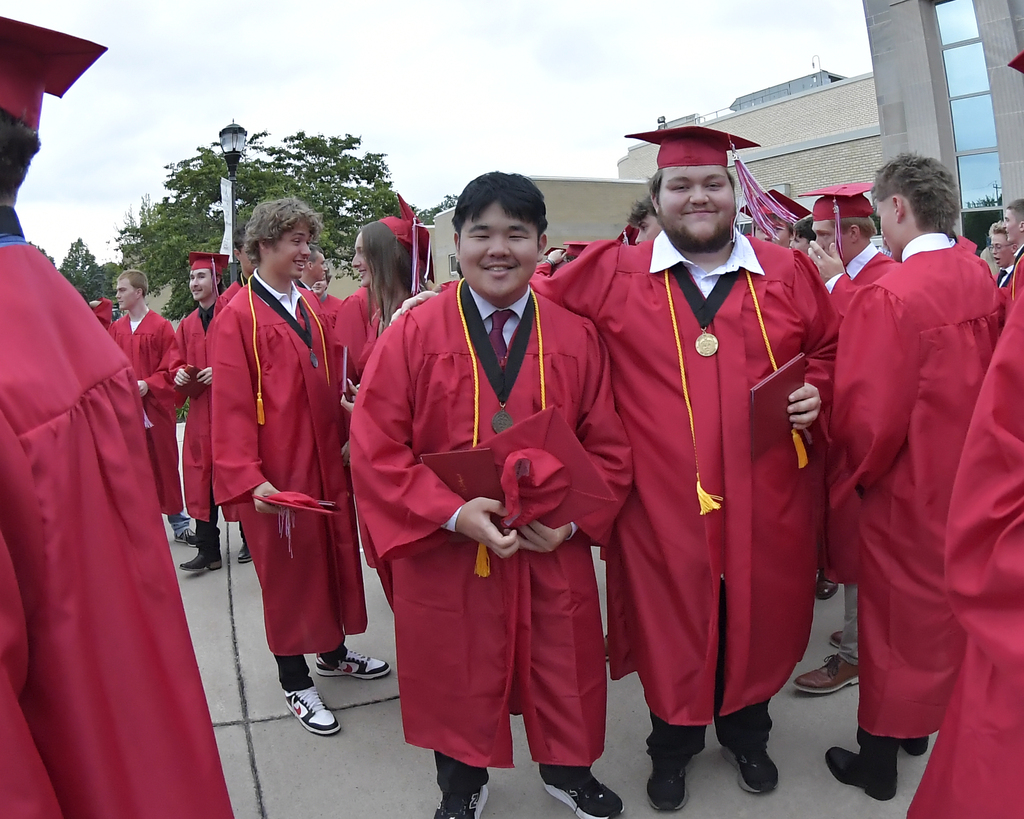 Friends pose for a photo after graduation.