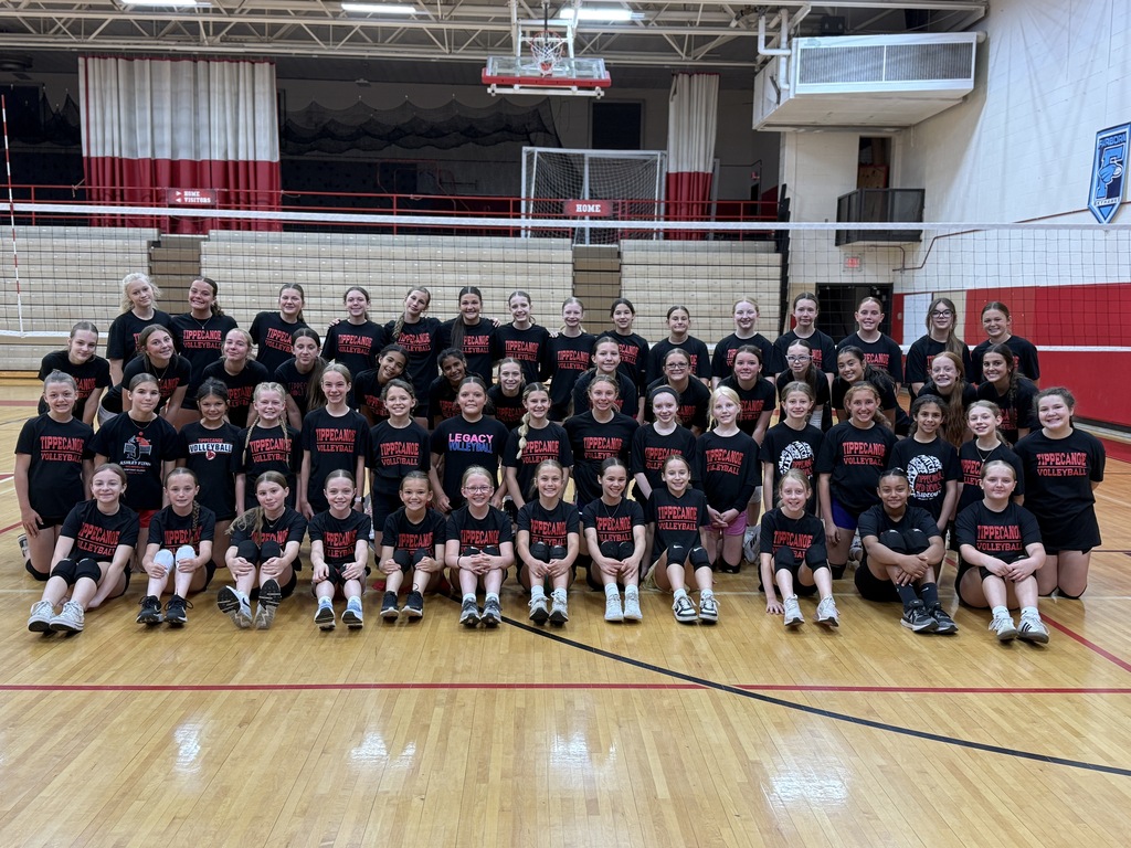 Rising 5th to 7th graders who attended a TMS volleyball camp pose for a group picture with the student volunteers.