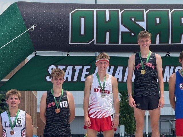 THS state track and field runner-up on the podium with his medal.