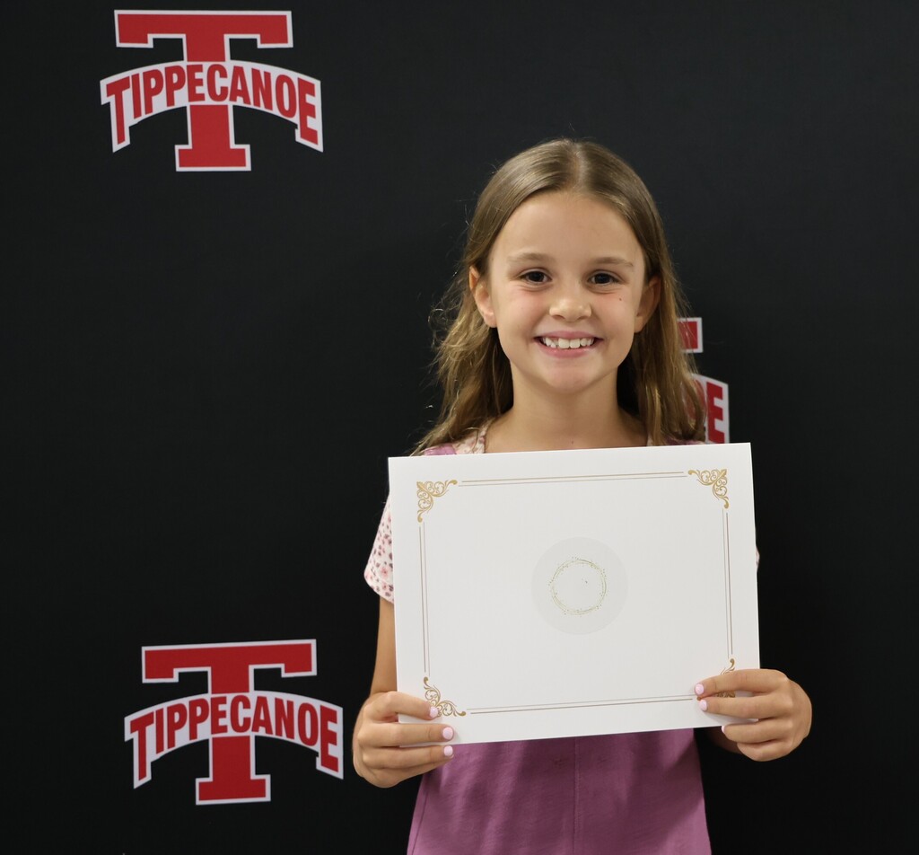 Board of Education honoree from Broadway Elementary holds her certificate after being recognized.  