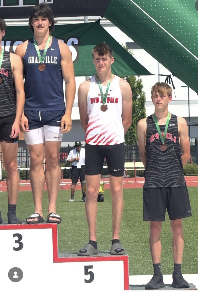 Picture of students on the podium after their high jump at OHSAA track and field state event.