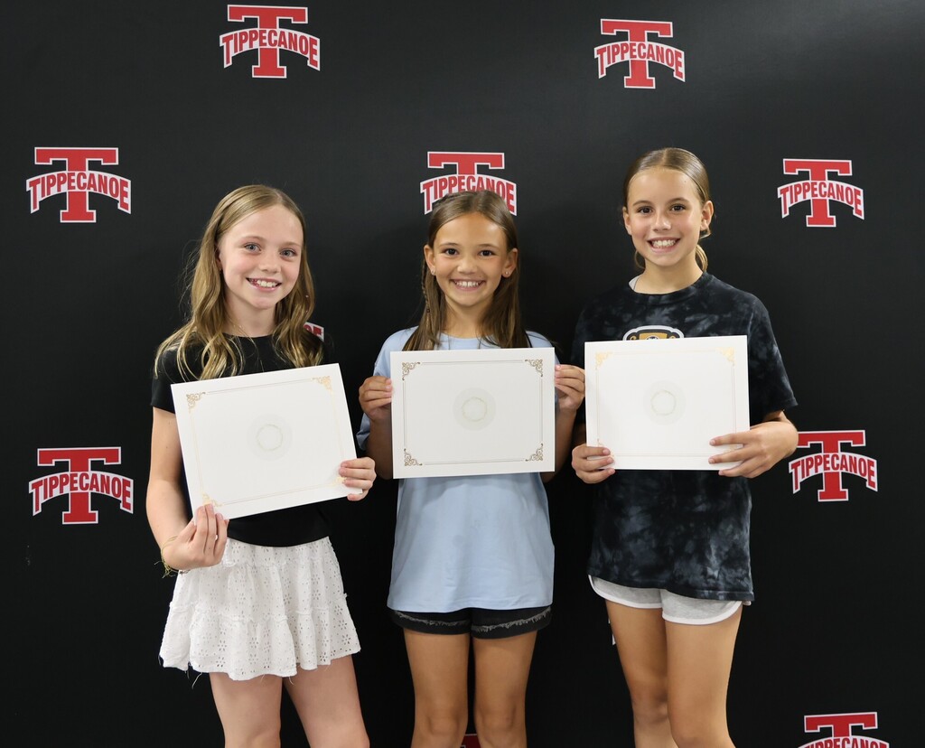 Three L.T. Ball students hold their certificates after being honored by the BOE.