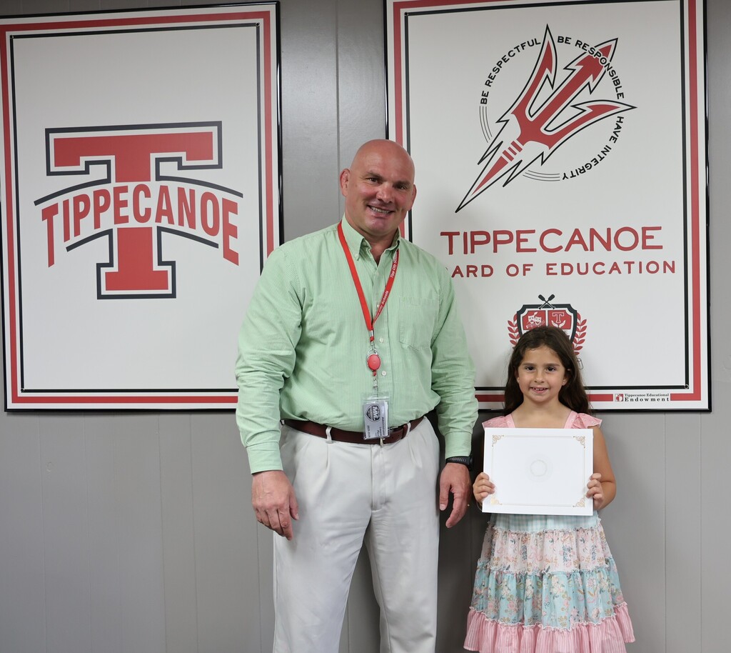 Broadway Elementary student with the superintendent at the BOE office.
