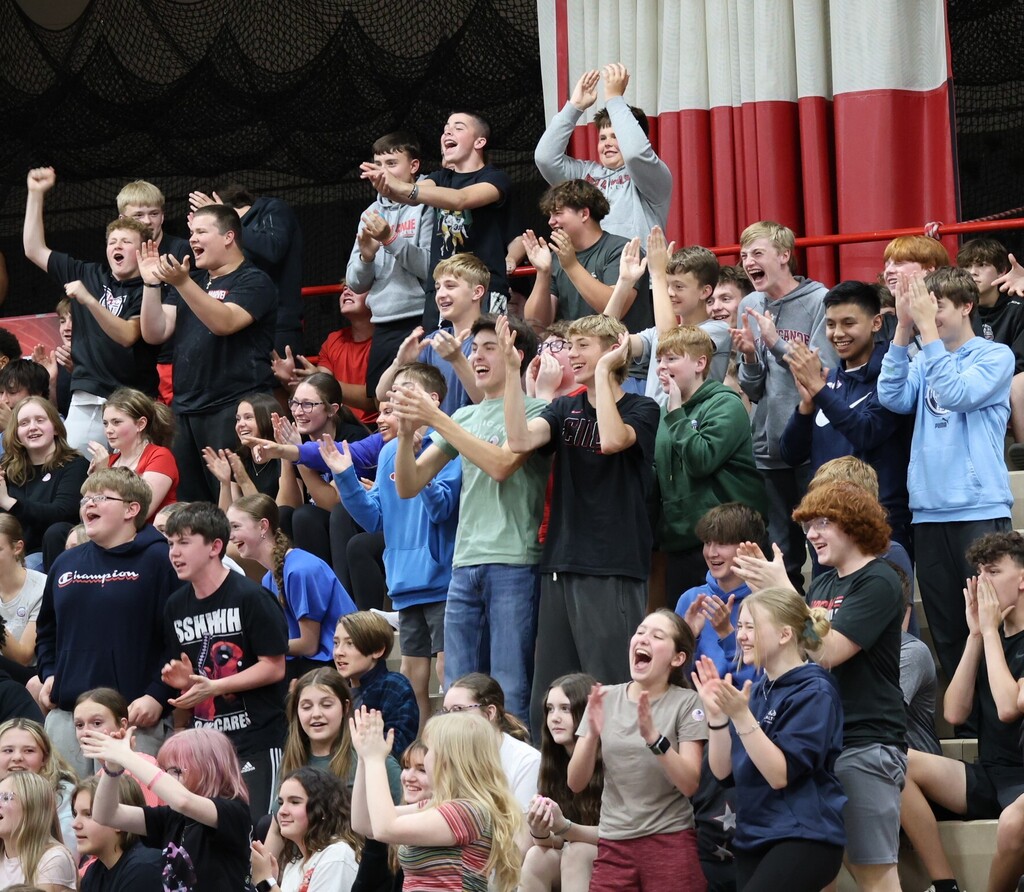 The crowd cheers on the student performers.