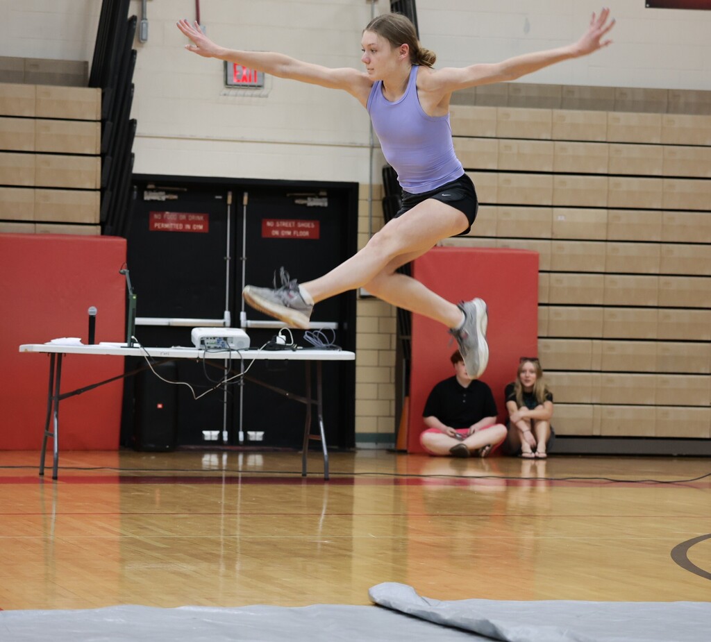 A student performs gymnastics at the TMS talent show.