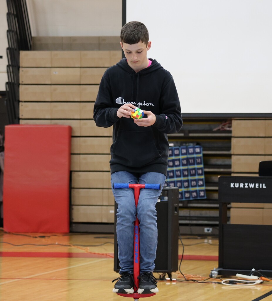 Solving the rubik's cube while on a pogo stick.
