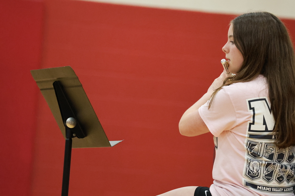 A TMS students performs an instrumental during the student talent show.